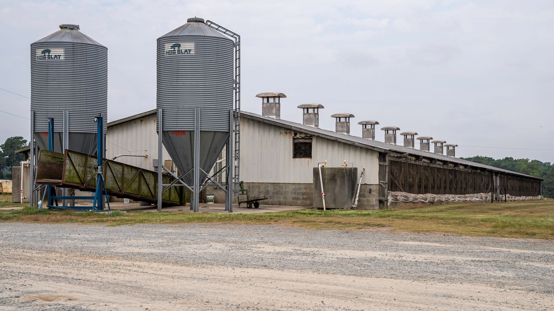 Large agricultural silos and farm building in North Carolina, illustrating rural industry.